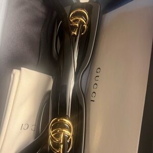 Gucci Glossy Black Sunglasses with Gold Detailing